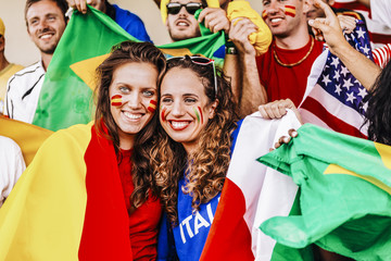 Fototapeta premium Supporters from Multiple Countries at Stadium All Together