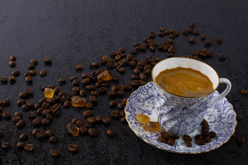 Cup of strong coffee and brown sugar