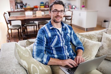 Portrait of man using a laptop