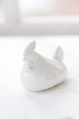 Easter decoration of a white roster on a white background