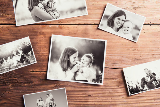 Mothers day composition. Black-and-white pictures, wooden backgr