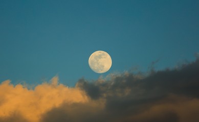 White moon over stormy clouds