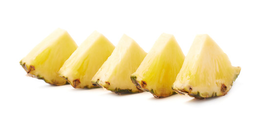 Slices of pineapple isolated over white background