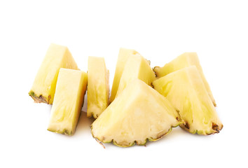 Pile of pineapple slices isolated over white background