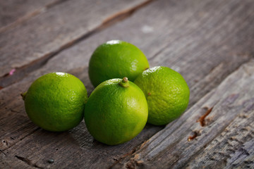 Four limes on table