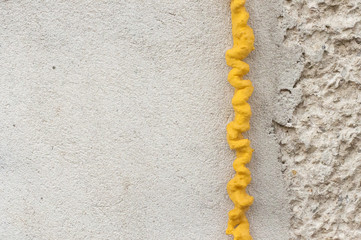 polyurethane foam filled crack in the wall - obrazy, fototapety, plakaty