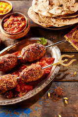 Spicy Indian food with meat on skewers