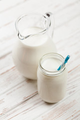 Milk jar on wooden table