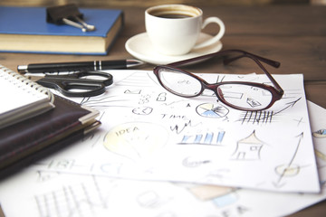 coffee,papers,glasses on table