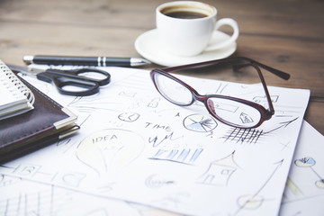 coffee,papers,glasses on table