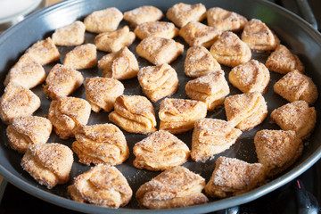 Freshly baked cottage cheese cookies in a round baking dish with non-stick coating