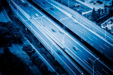 Obraz premium aerial view of highway traffic,blue toned image.
