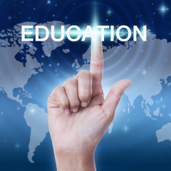 hand pressing education word button. business concept