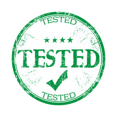 Green grunge rubber stamp with the word tested written with capital letters