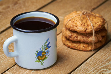 Metal cup, herb and cookies