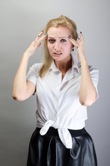 Woman holding hands on her head, depression, pain, migraine