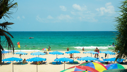 Tourists on Kata beach on a sunny day, Phuket, Thailand 