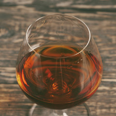 Cognac, brandy or whiskey in large round glass