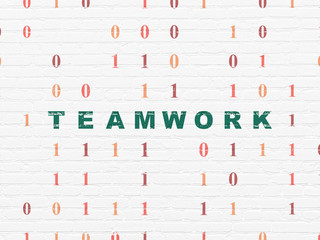 Finance concept: Teamwork on wall background