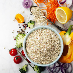 Bowl of healthy white quinoa seeds with vegetables