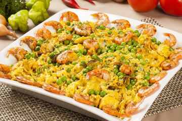 Spanish dish paella with seafood, shrimps, squid, rice, saffron,