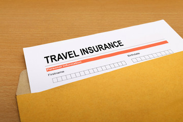 travel Insurance application form on brown envelope