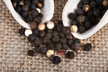 Wooden scoop with dried pepper berries