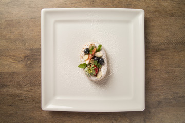 fresh fried pumpkin churros with red fruits on plate