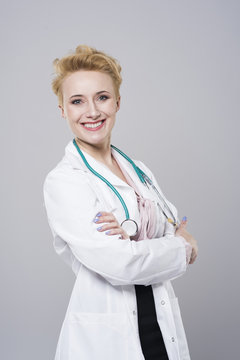 Cheerful female doctor with stethoscope