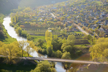 Naklejka premium Sunset Village and River
