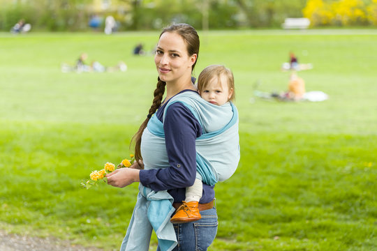 Mother And Child In Baby Sling