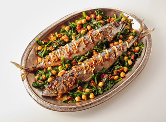 Oval shaped platter of spicy baked fish