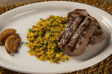 Fillet mignon grilled on plate with crumbs and bacon