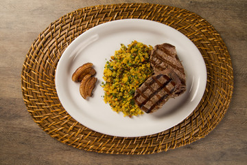 Fillet mignon grilled on plate with crumbs and bacon