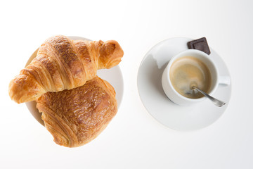 Cup of coffee with french croissant and chocolatine with chocolate