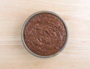 Black bean dip in a bowl on a wood table
