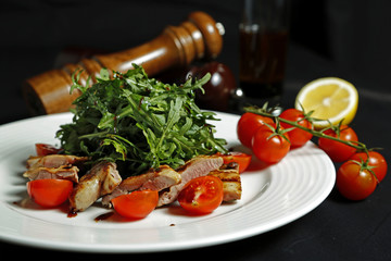 Arugula salad on a white plate