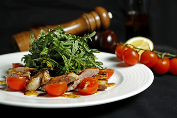 Arugula salad on a white plate