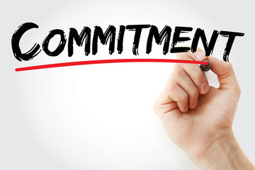 Hand writing Commitment with marker, business concept background