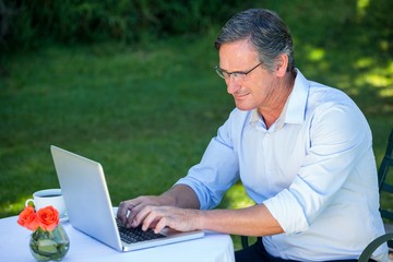 Casual businessman using laptop