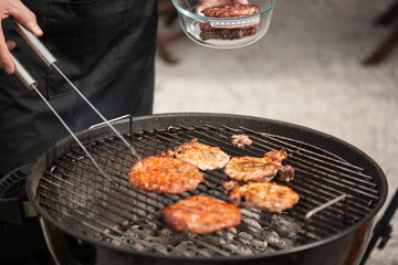 Putting steaks and burgers in a bowl