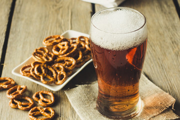 Glass of ale and snacks vintage