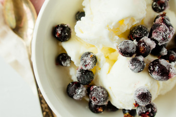 Ice-cream with frozen berries top view
