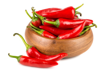Red hot chili peppers in wooden bowl