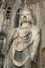 Fototapeta na wymiar Close up Buddha rock statue in Longmen Grottoes, Luoyang, China