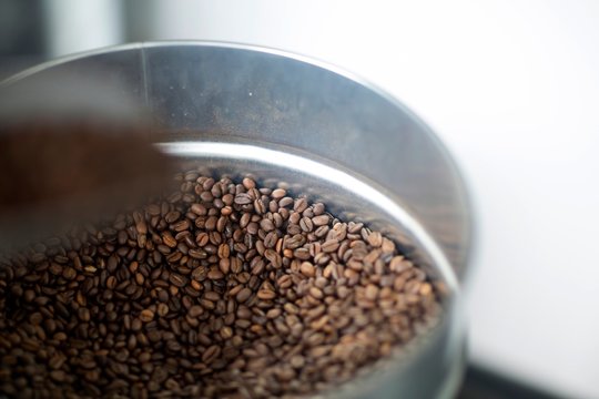 Close up of fresh coffee beans in tin