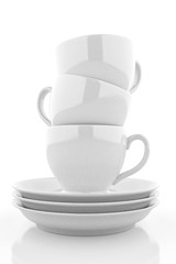 White coffee cups with saucers. 3D rendering
