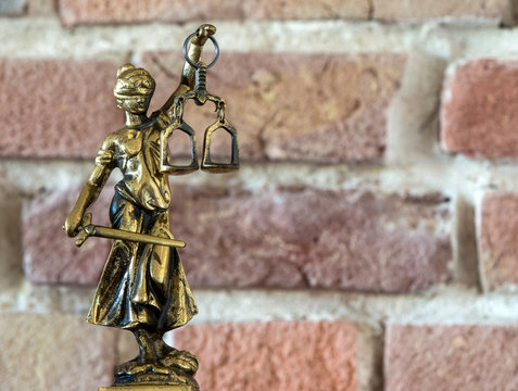 Lady Justice - Temida - Themis, Lady of Justice on background of the wall
