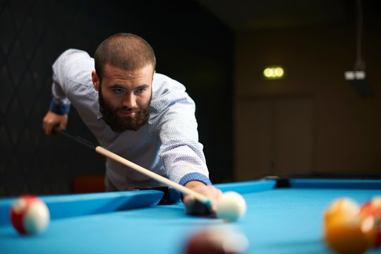 Man playing pool in club