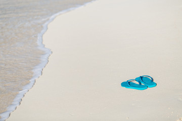 Flip flops on a tropical beach